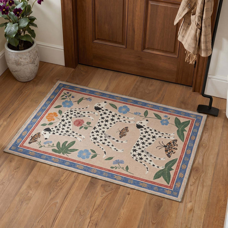 Lulu Washable Dogs Butterfly Floral Rug on wood flooring in entryway with blue and red border and black star-patterned dogs