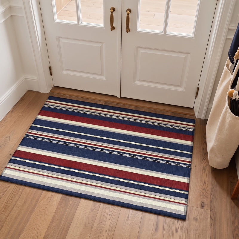 Vareli Washable Coastal Striped Navy Rug 3x5 placed at a welcoming front door entryway
