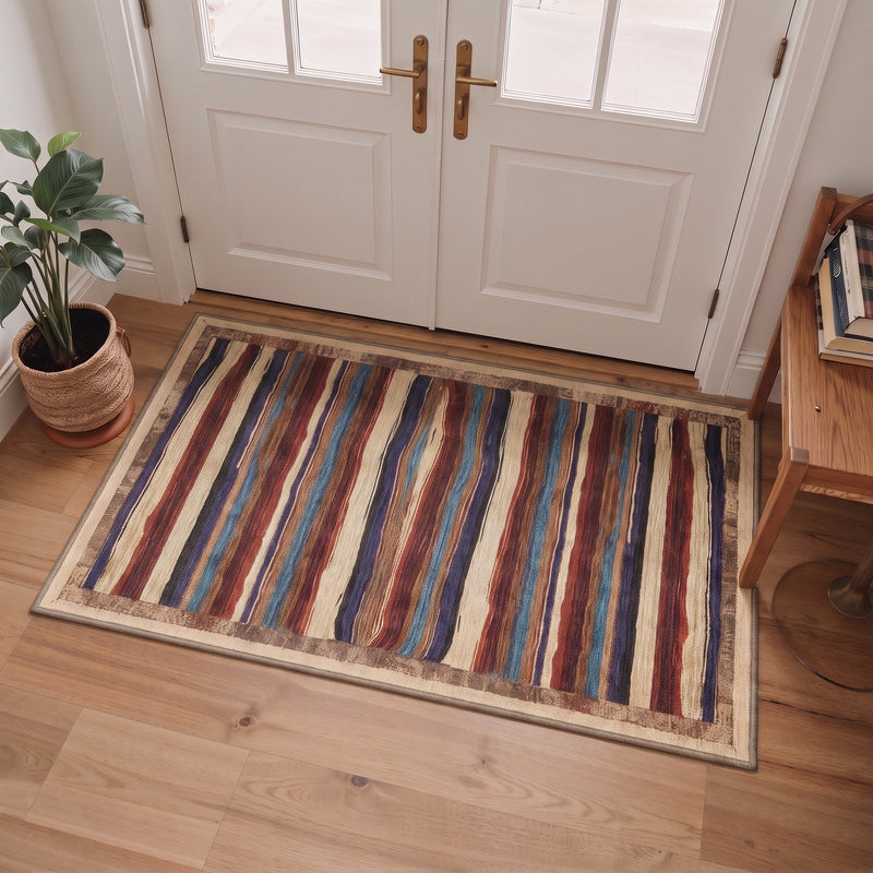 Elvara Washable Southwestern Striped Multicolor Rug 3x5 placed at a welcoming front door entryway