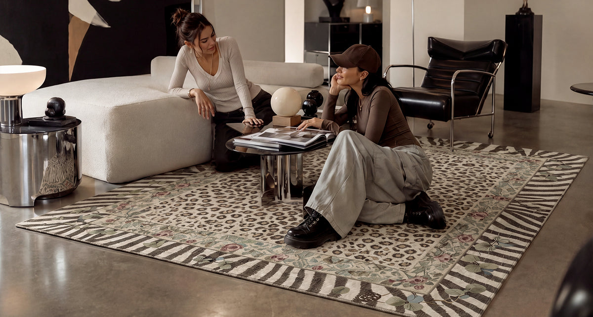 Two friends relaxing in a bedroom styled with a GENIMO rug